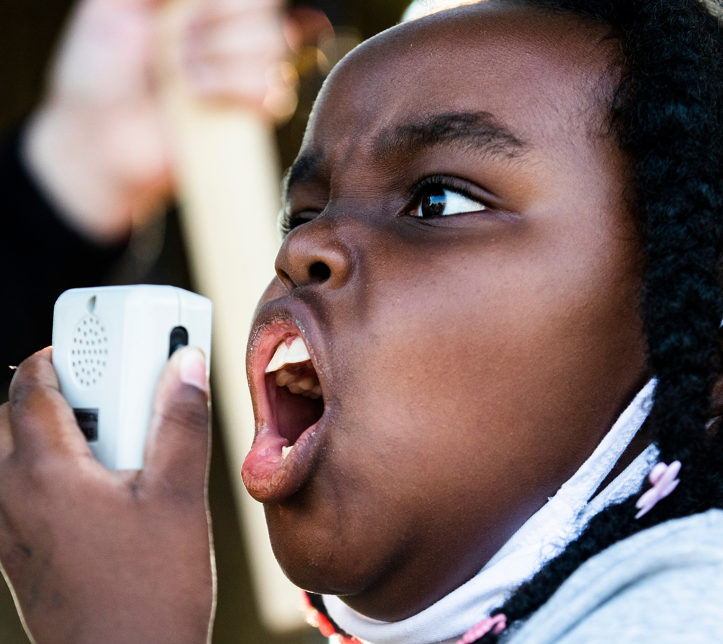 Rosetta Walker, 9, leads chants Friday, July 9, 2021, during a protest by Indianapolis Public Library employees in Indianapolis.